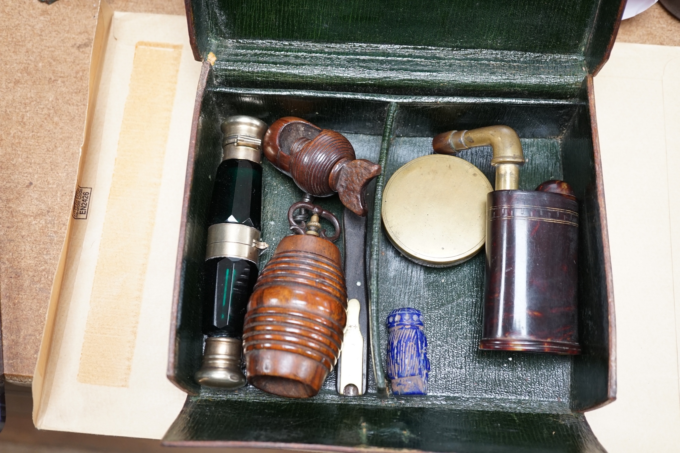 A pocket sundial, a nut cracker, a nutmeg grater, two double ended scent bottles etc., in a leather case, scent bottle 13cm long. Condition - good